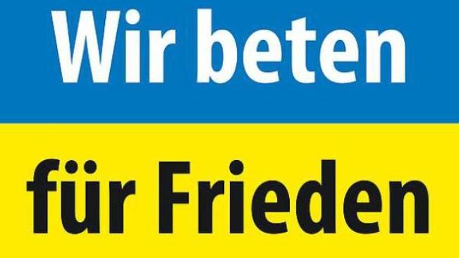 Das Logo heißt: Wir beten für Frieden